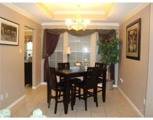 a view of a dining room with furniture and window