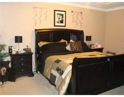 a bedroom with a bed and lamp