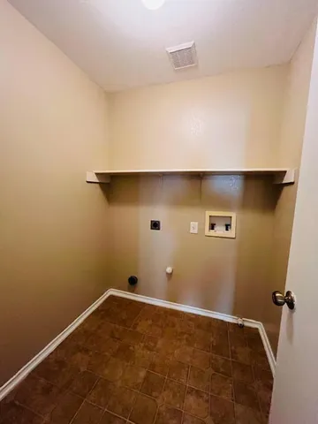 a view of a room with rack on the wall