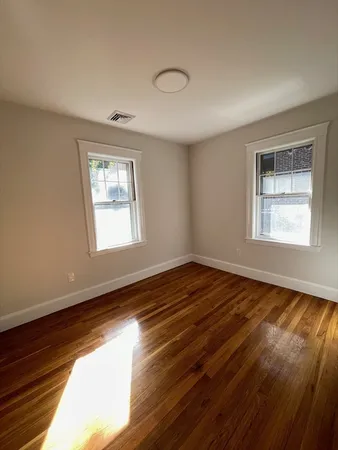 a view of an empty room and window
