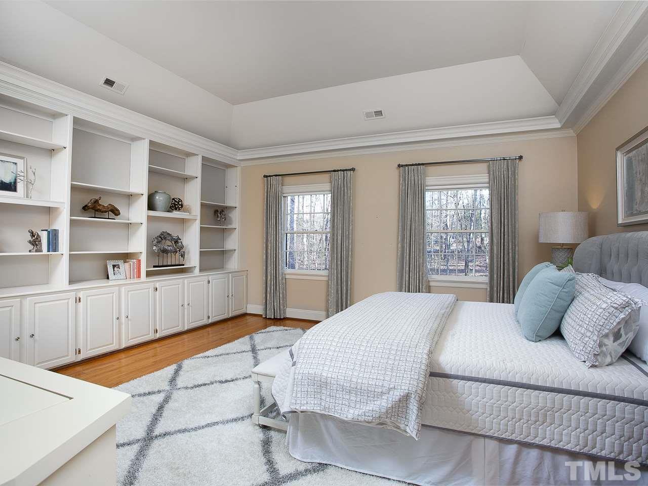 1528 Pinecrest Road Durham, NC 27705 - Photo 14 of 30 a bedroom with a large bed and a window