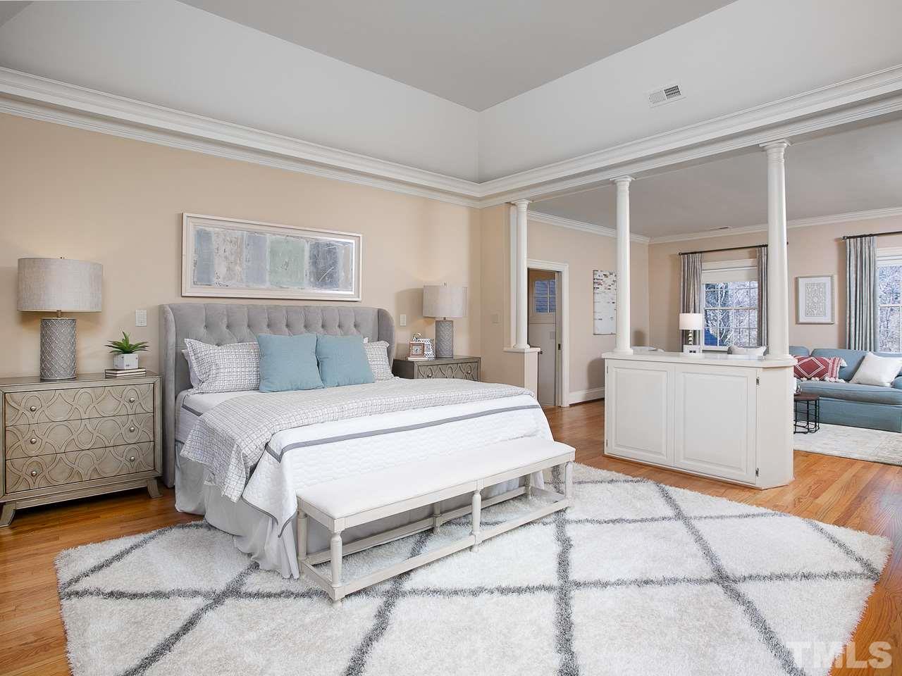 1528 Pinecrest Road Durham, NC 27705 - Photo 15 of 30 a bedroom with a bed a mirror and lamp