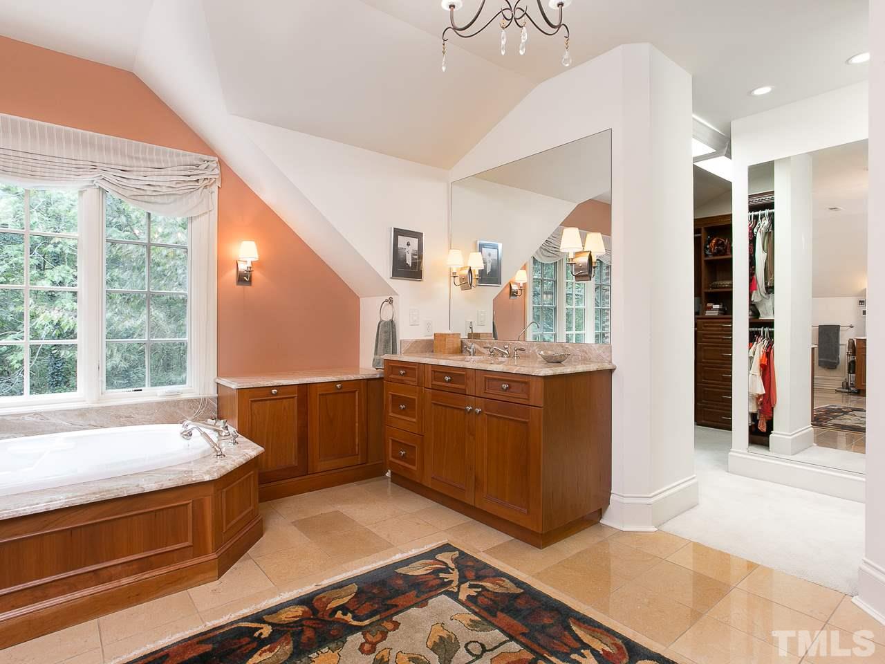 1528 Pinecrest Road Durham, NC 27705 - Photo 17 of 30 a kitchen with stainless steel appliances kitchen island granite countertop a refrigerator and a stove