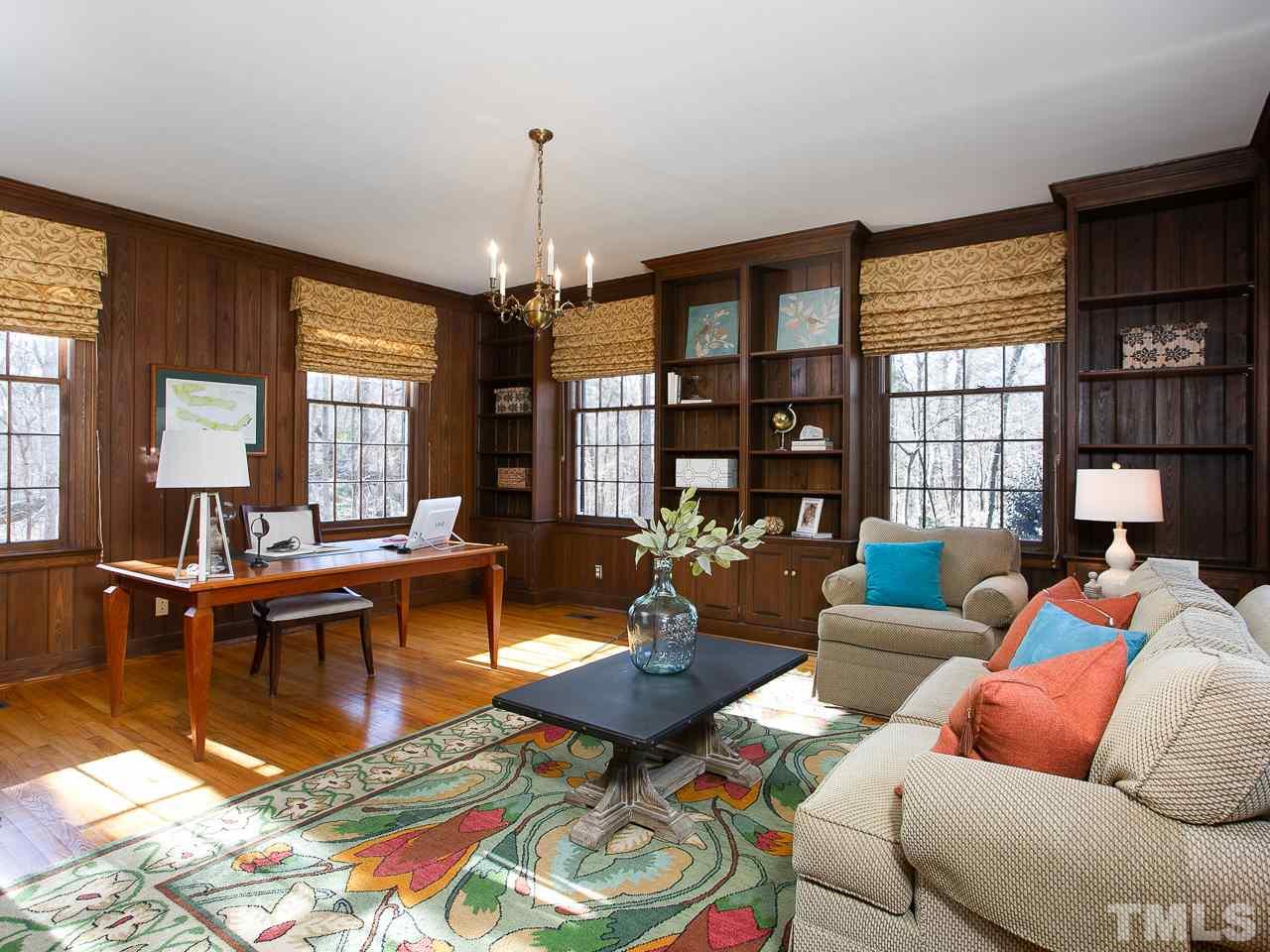 1528 Pinecrest Road Durham, NC 27705 - Photo 19 of 30 a living room with furniture a chandelier and a dining table