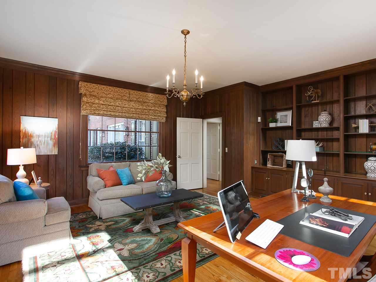 1528 Pinecrest Road Durham, NC 27705 - Photo 20 of 30 a living room with furniture a lamp and a chandelier