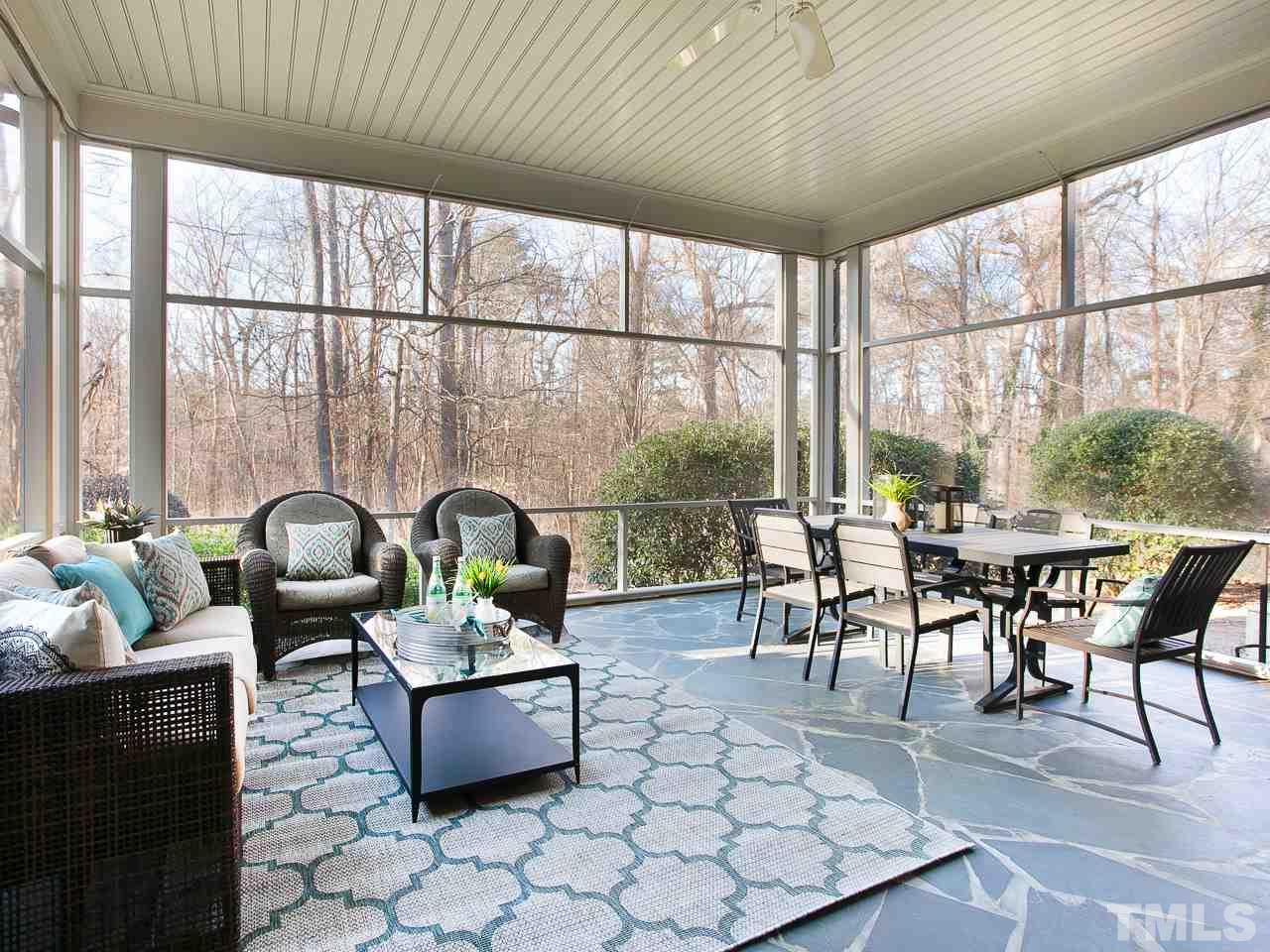 1528 Pinecrest Road Durham, NC 27705 - Photo 25 of 30 a dining room with furniture a table and a large window