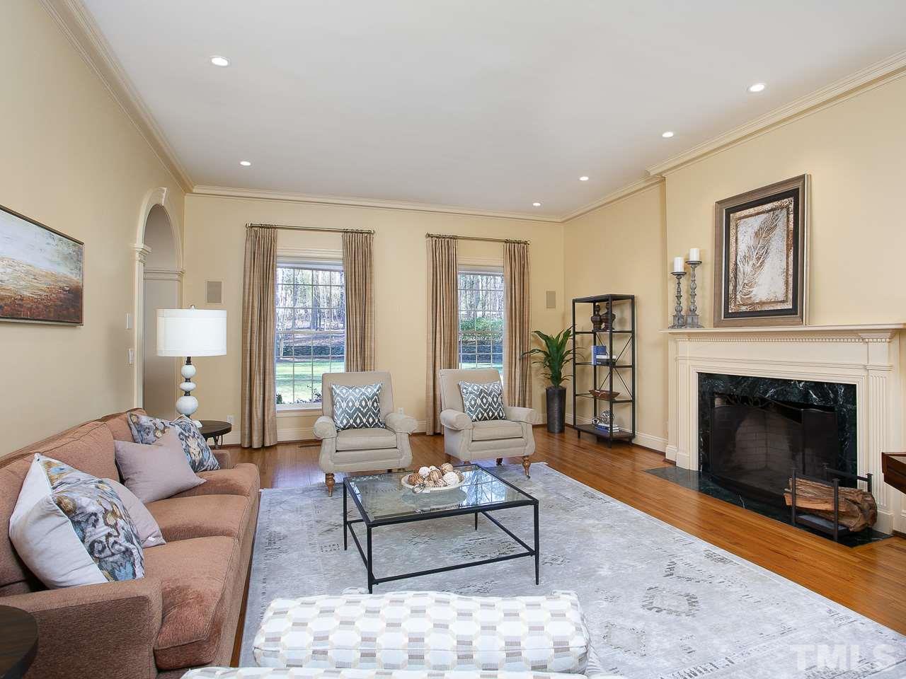 1528 Pinecrest Road Durham, NC 27705 - Photo 4 of 30 a living room with furniture and a fireplace