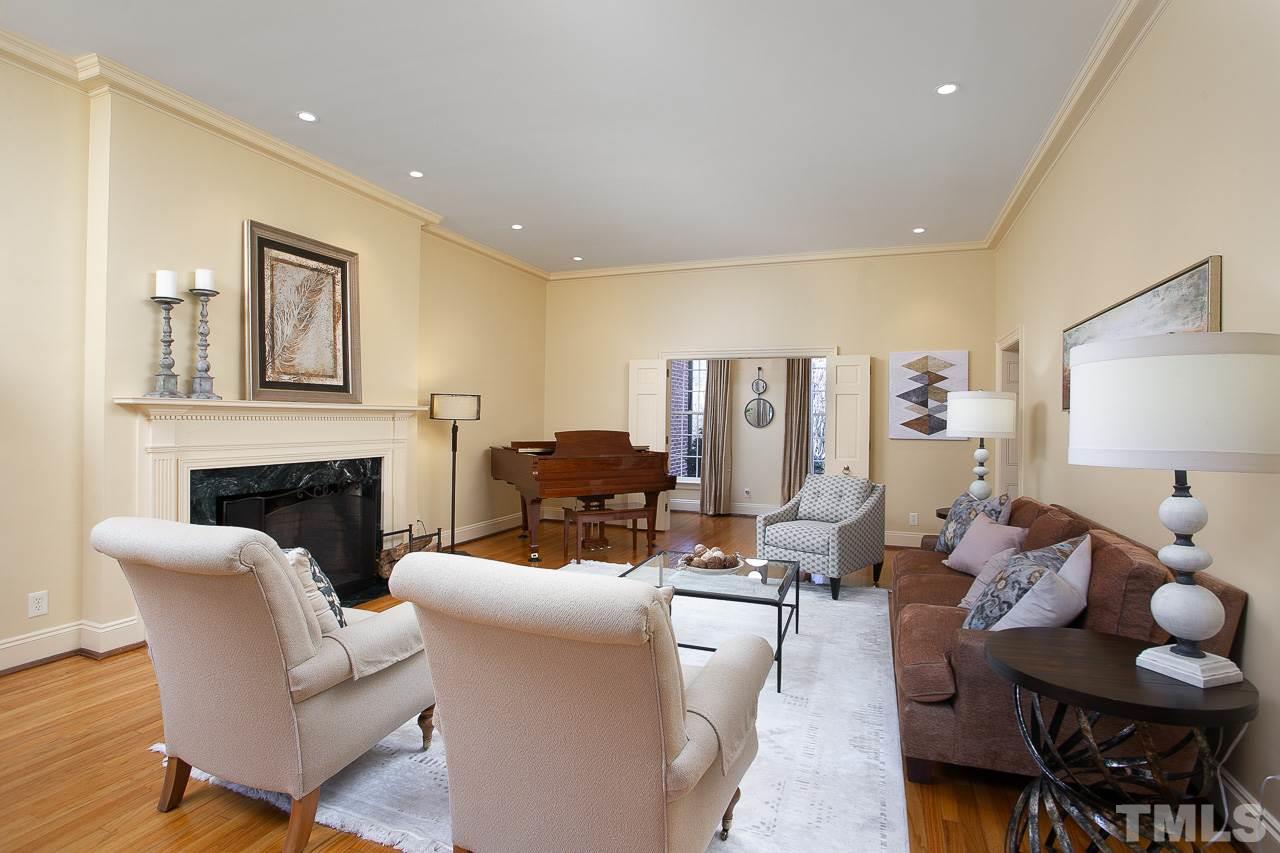1528 Pinecrest Road Durham, NC 27705 - Photo 5 of 30 a living room with furniture couches and a fireplace