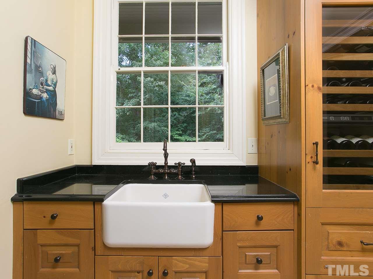 1528 Pinecrest Road Durham, NC 27705 - Photo 9 of 30 a close view of sink and mirror