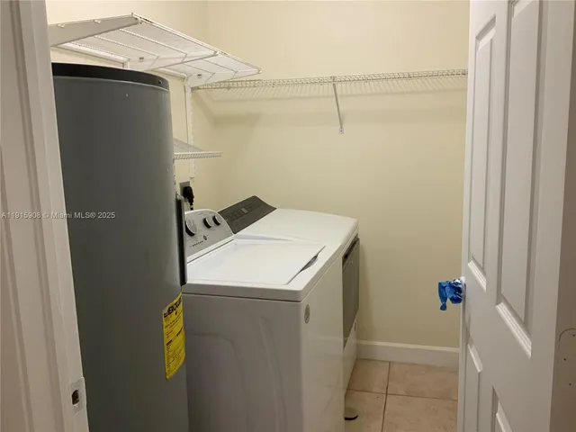 a view of backyard with wooden fence