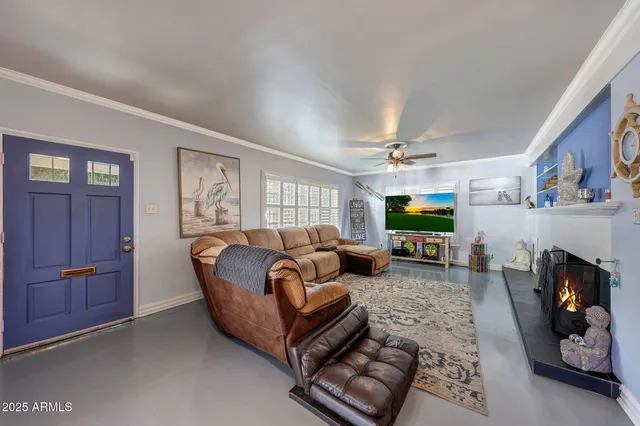 a living room with furniture and a fireplace