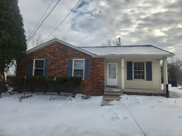a front view of a house with yard