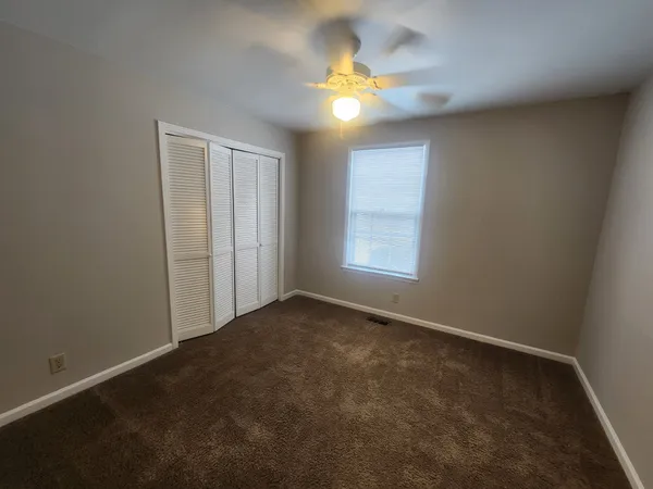a view of a room with rack on the wall