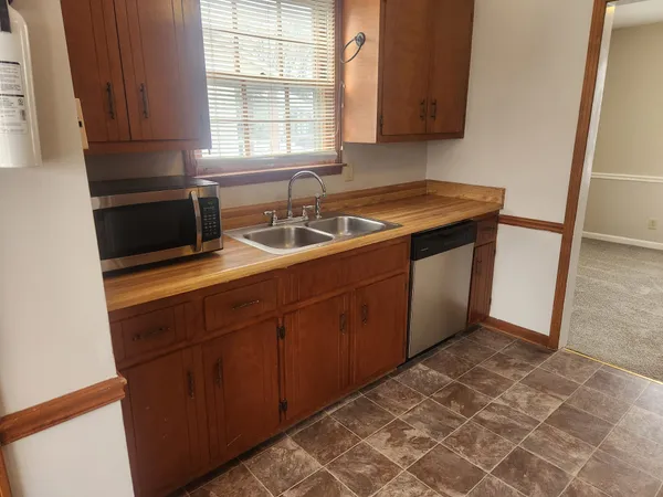 a kitchen with a stove microwave and refrigerator