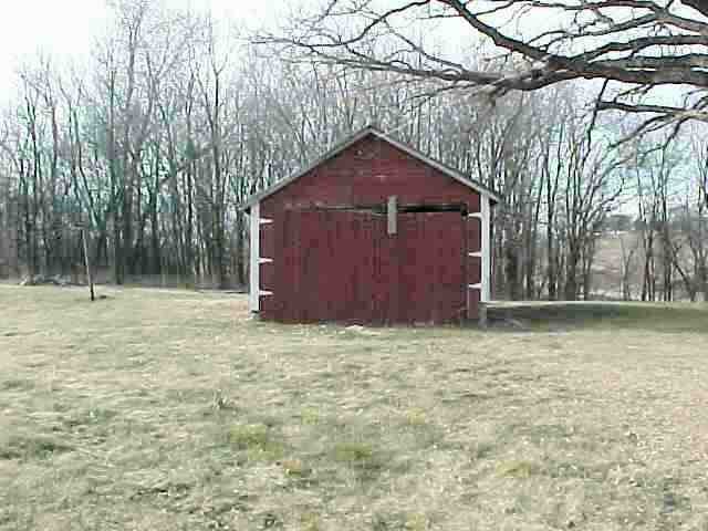 5747 West Wagner Road Lena, IL 61048 - Photo 8 of 9 a house is sitting in middle of forest