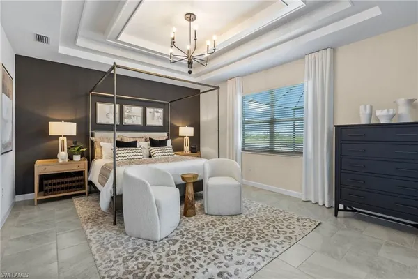 a bedroom with a bed and ceiling fan