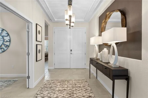a view of a hallway with wooden floor and a cabinet