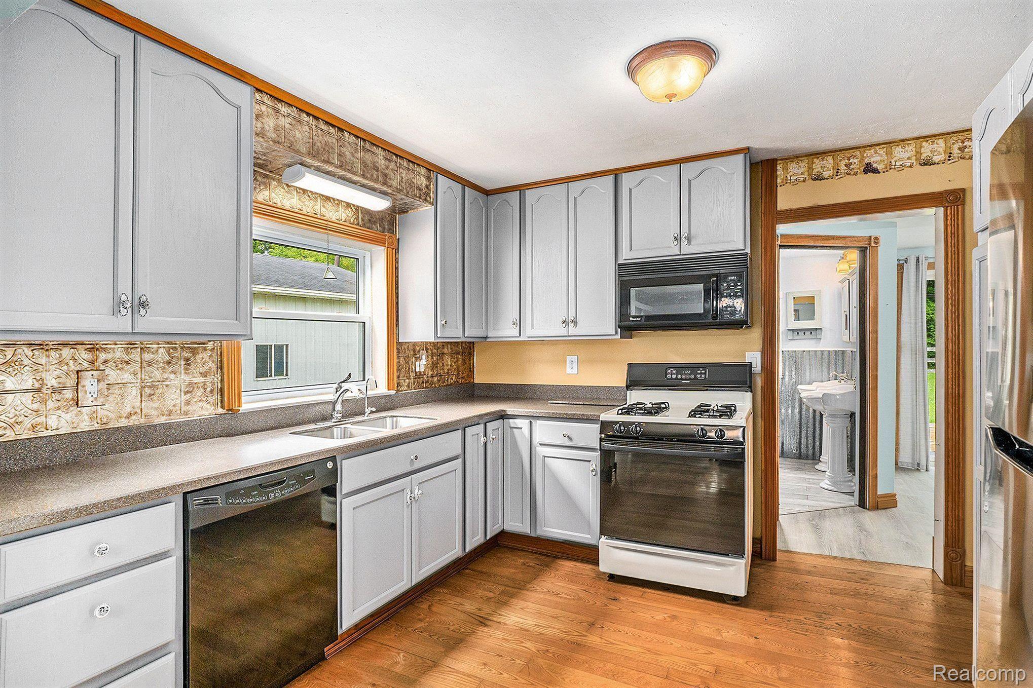 1950 South Lake George Road Attica, MI 48412 - Photo 5 of 30 Kitchen w/Hardwood Floors