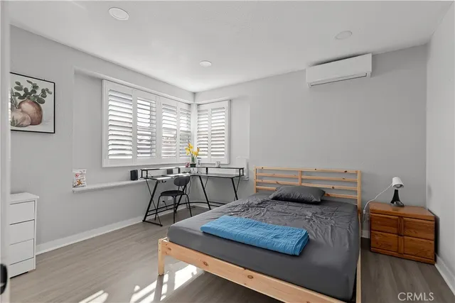 a kitchen with a sink a refrigerator and cabinets