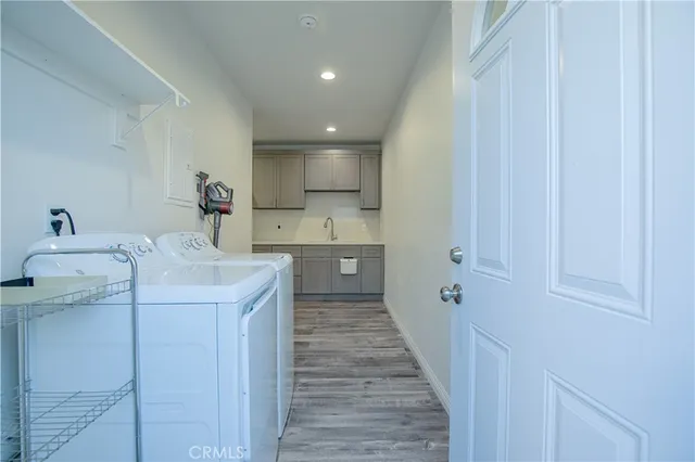 a kitchen with a sink cabinets and stainless steel appliances