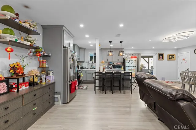 a living room with lots of furniture and toys