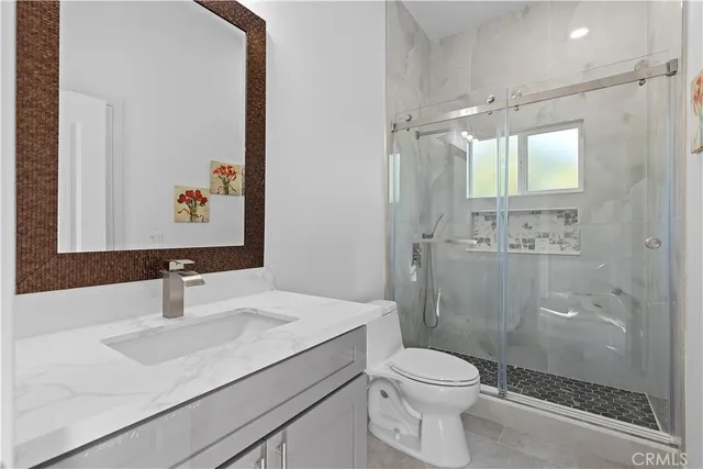 an aerial view of a house with outdoor space