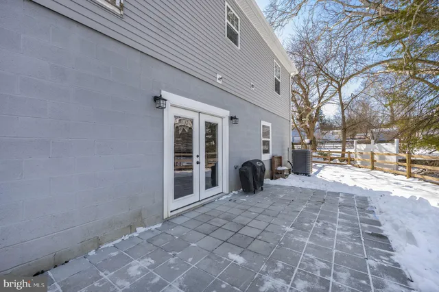 a view of a parking space with a patio