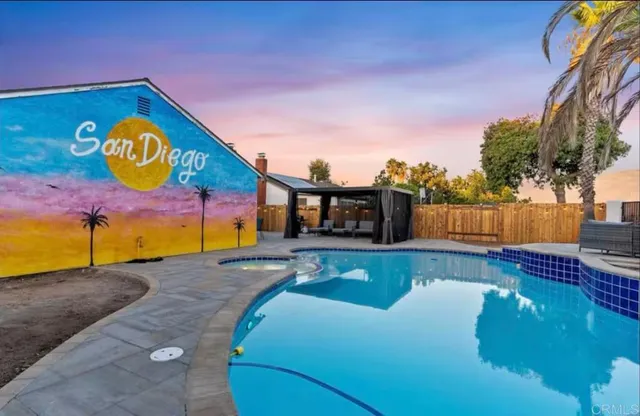 a view of swimming pool with a yard