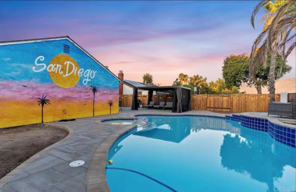 a view of swimming pool with a yard