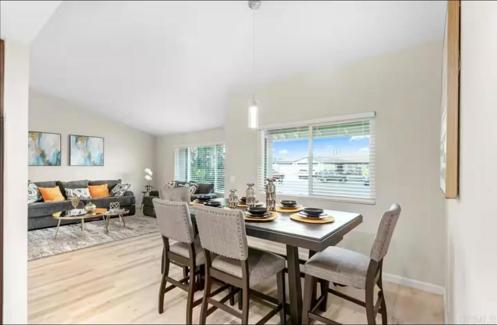 409 Pesca Court Spring Valley, CA 91977 - Photo 11 of 28 a view of a dining room with furniture window and outside view