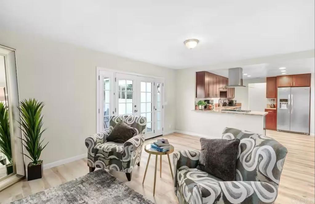 409 Pesca Court Spring Valley, CA 91977 - Photo 2 of 28 a living room with furniture potted plant and a large window