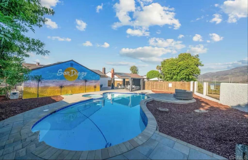 409 Pesca Court Spring Valley, CA 91977 - Photo 22 of 28 a view of a swimming pool with an outdoor space