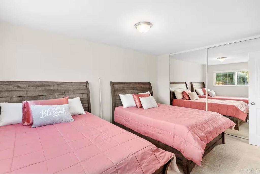 409 Pesca Court Spring Valley, CA 91977 - Photo 26 of 28 a bedroom with two beds and a night stand