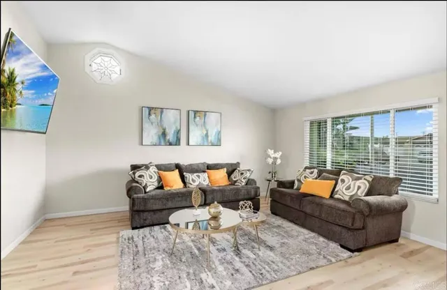 a living room with furniture and a large window