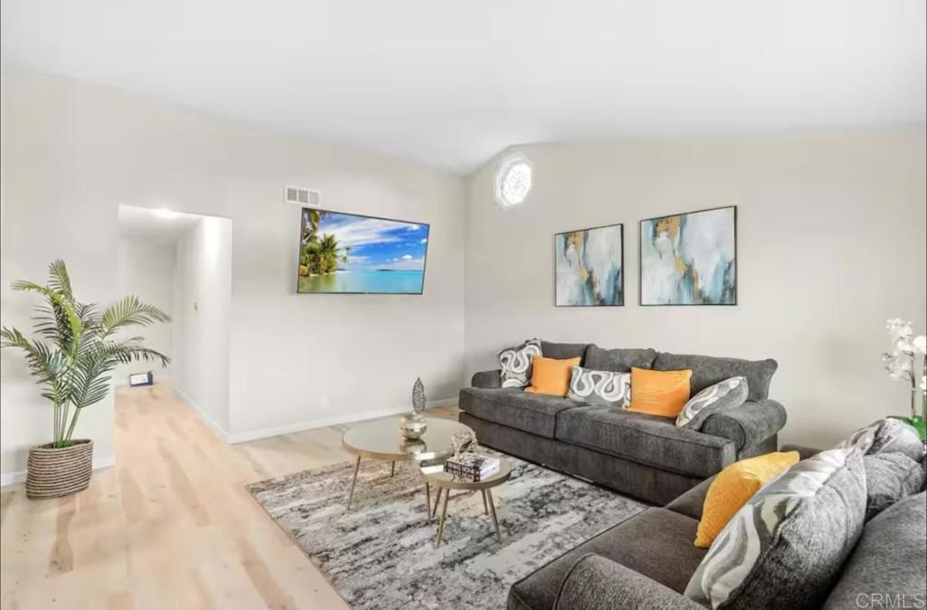 409 Pesca Court Spring Valley, CA 91977 - Photo 5 of 28 a living room with furniture and a potted plant