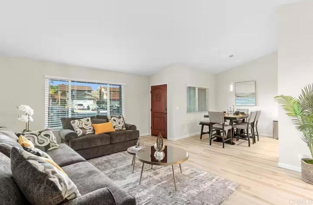 409 Pesca Court Spring Valley, CA 91977 - Photo 6 of 28 a living room with furniture and a large window