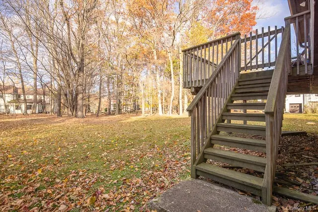 a view of stairs and wooden floor