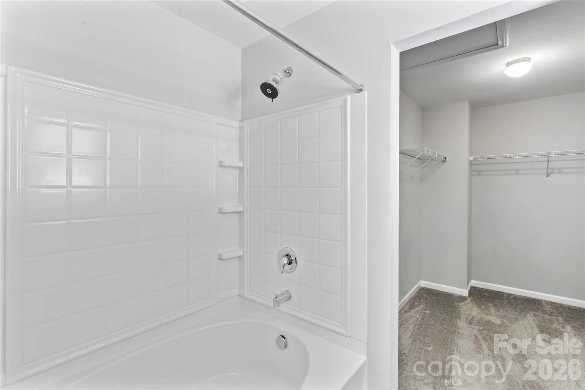 12561 Garron Road Midland, NC 28107 - Photo 21 of 36 a bathroom with a bathtub and a shower