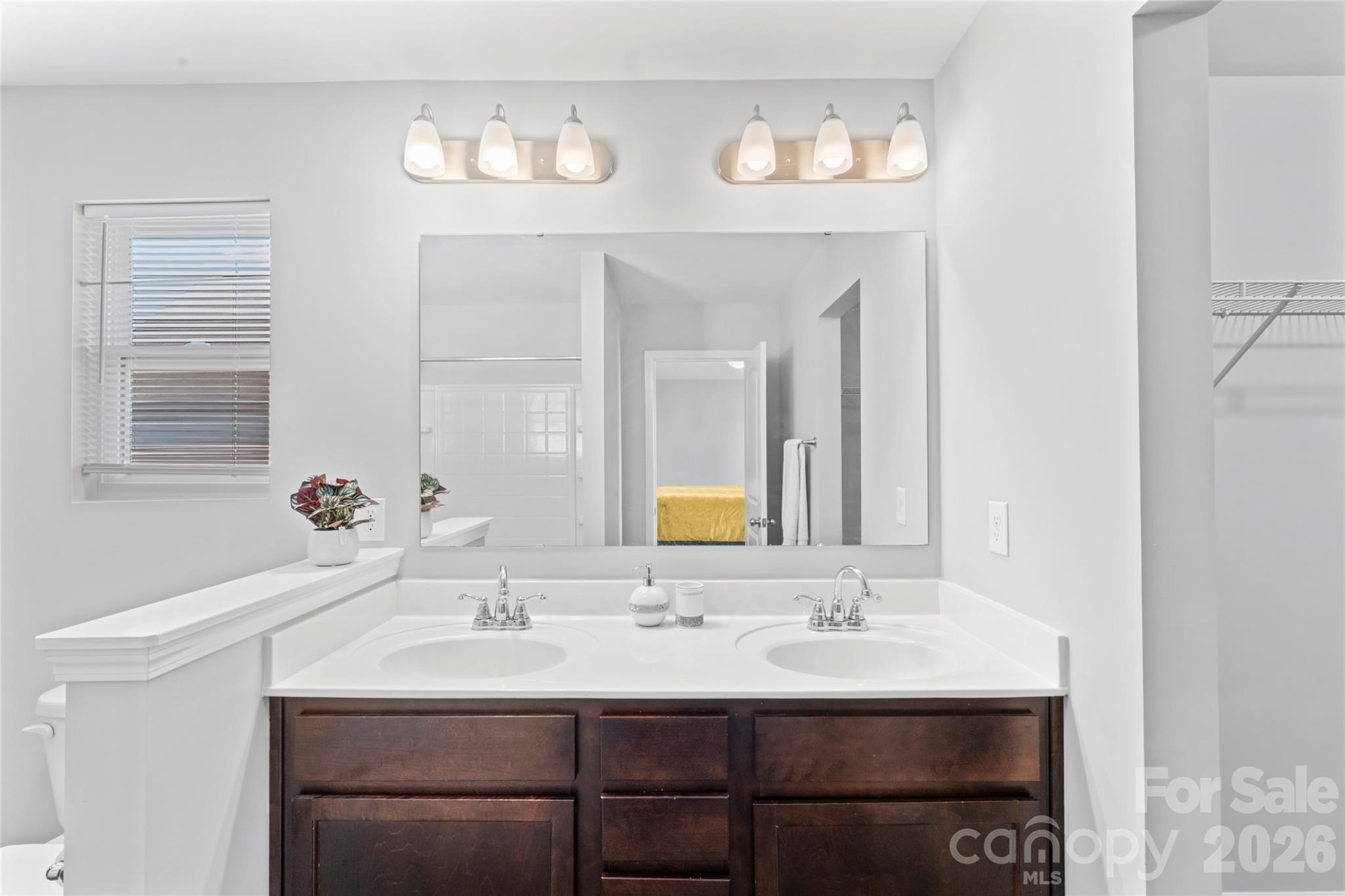 12561 Garron Road Midland, NC 28107 - Photo 22 of 36 a bathroom with a sink and a mirror