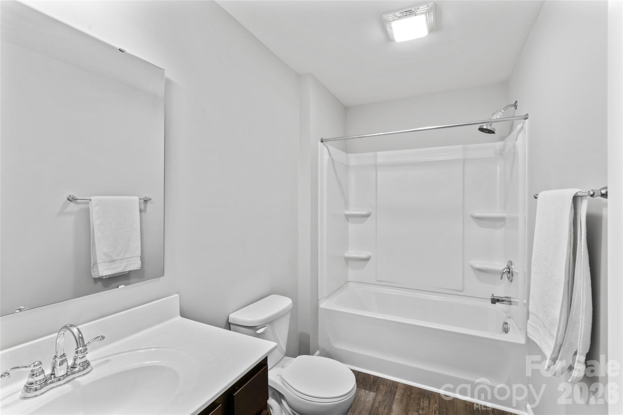 12561 Garron Road Midland, NC 28107 - Photo 23 of 36 a bathroom with a sink toilet and a bathtub