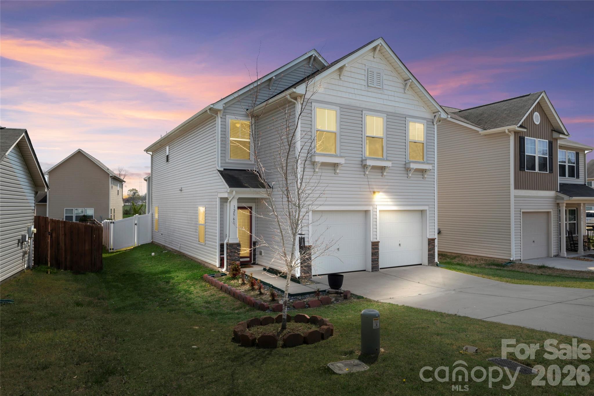 12561 Garron Road Midland, NC 28107 - Photo 29 of 36 a front view of a house with a yard