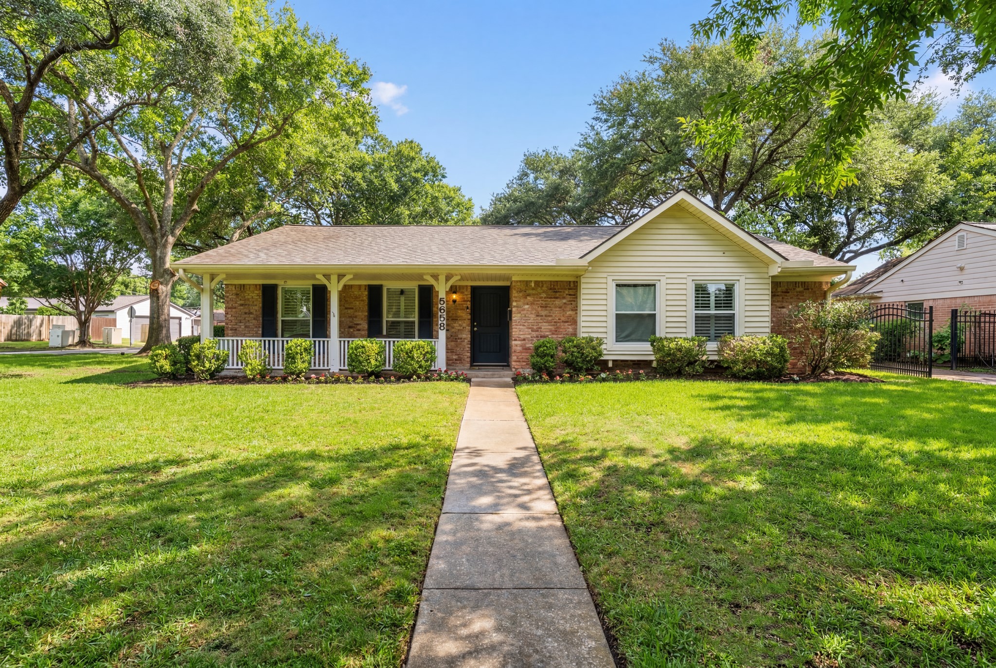 5658 Cartagena Street Houston, TX 77035 - Photo 1 of 33 Welcome to this charming brick and siding traditional home with exceptional curb appeal!