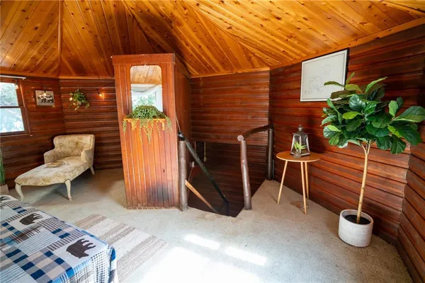 a bedroom with furniture and a window