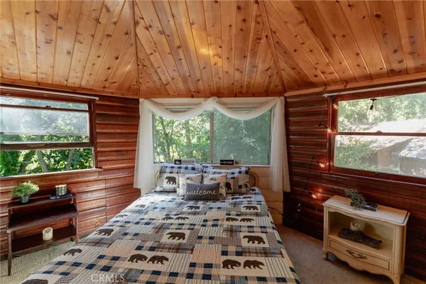a building outdoor space with patio furniture and potted plants