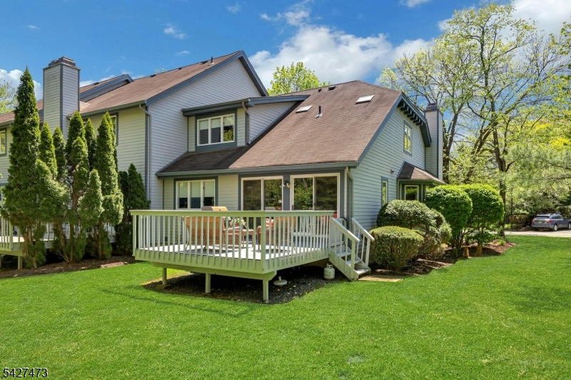 100 Easedale Road, Unit 100 Wayne, NJ 07470 - Photo 4 of 43 a front view of a house with garden