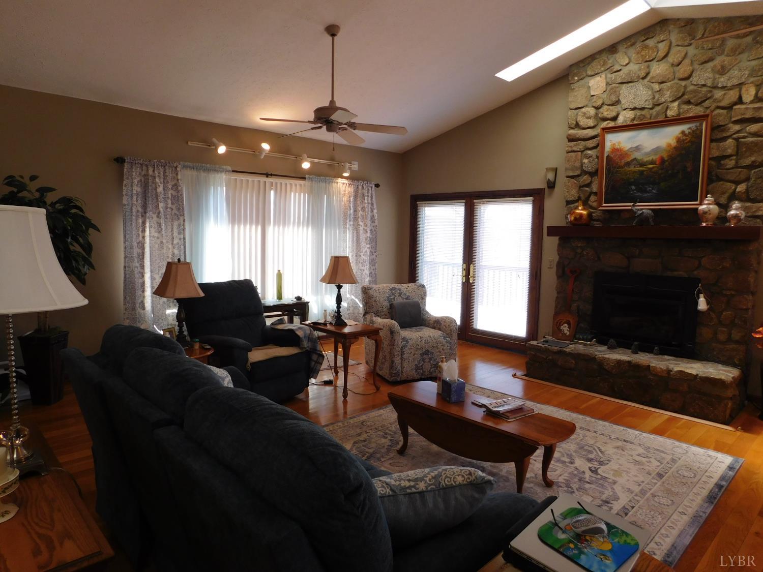 320 Ruth Drive Madison Heights, VA 24572 - Photo 20 of 60 a living room with furniture and a fireplace