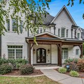 front view of a house with a garden