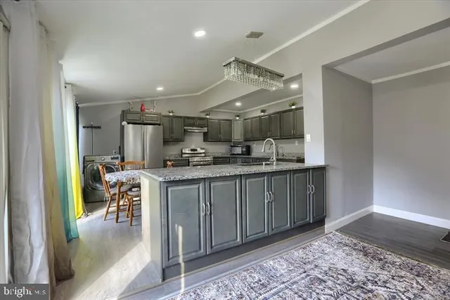 a kitchen with kitchen island granite countertop lots of counter top space