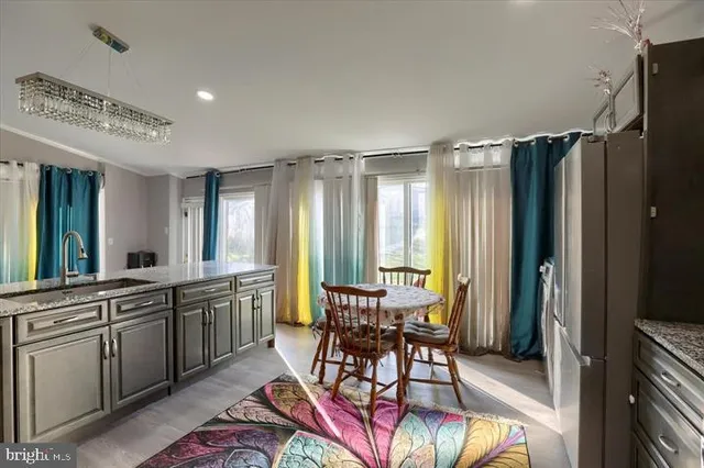 a view of a a dining room with furniture window and outside view