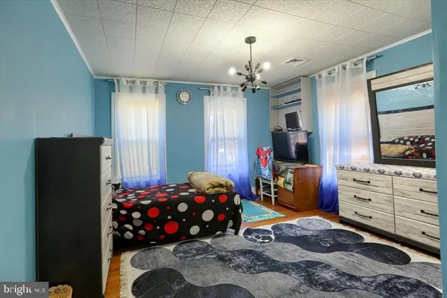 a bedroom with bed and window